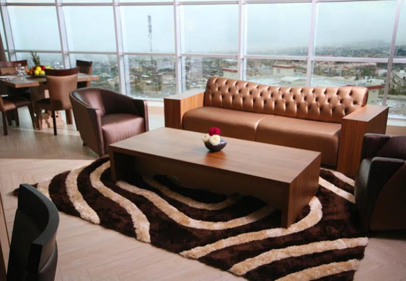 Titanic Hotel & Spa Sulaymaniyah Экстерьер фото A living room with a carpet